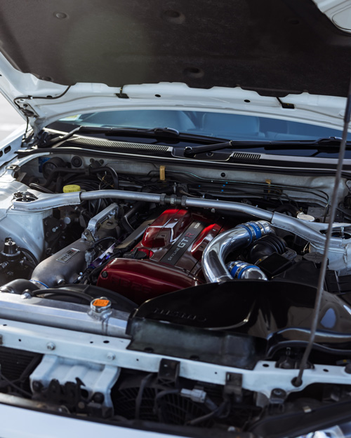 White Nissan Skyline R34 GTR close up of engine